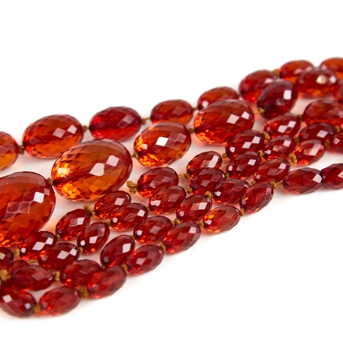 1225 - A Vintage graduate single-row faceted amber bead necklace, beads measuring from 29.8mm to 11.5mm, ne... 