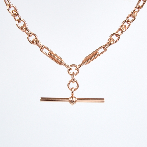 1226 - A modern unmarked 9ct rose gold fancy link double Albert chain necklace, elongated double-bar and ro... 