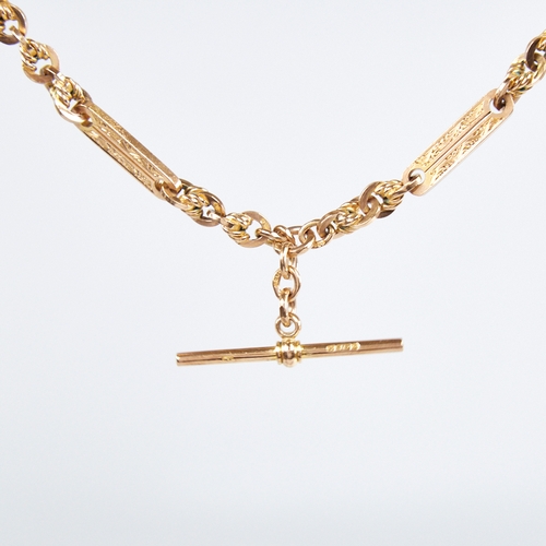 1227 - An early/mid-20th century 9ct gold fancy link double Albert chain necklace, with engraved oval bar a... 