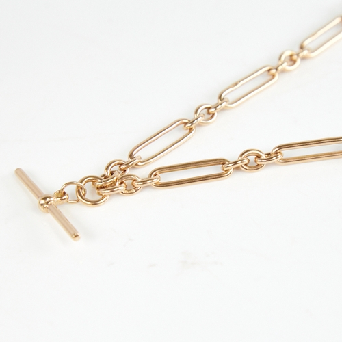 1228 - An early/mid-20th century 9ct gold double Albert chain necklace, fancy fetter links with T-bar dog c... 