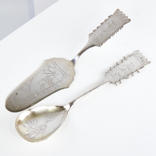 1231 - A Vintage Swedish silver serving spoon and a similar cake slice, engraved reindeer and Lapp decorati... 