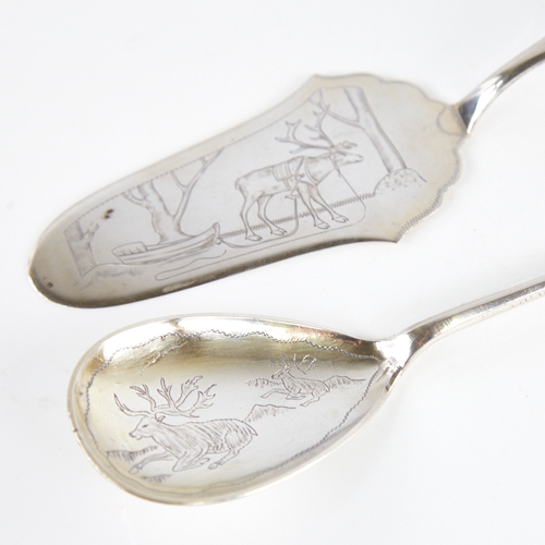 1231 - A Vintage Swedish silver serving spoon and a similar cake slice, engraved reindeer and Lapp decorati... 