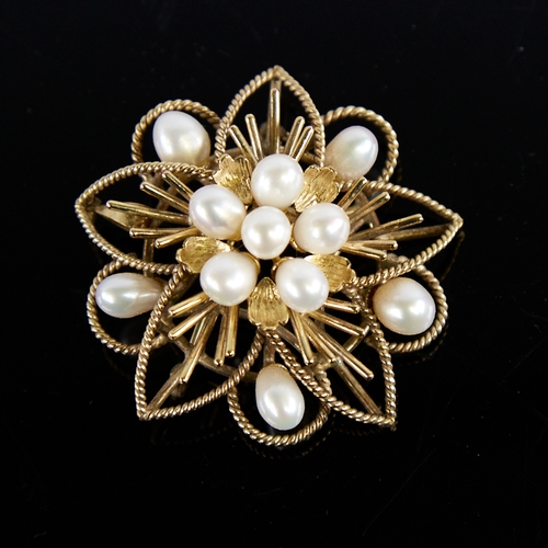 1234 - A Vintage Singaporean 14ct gold pearl floral brooch/pendant, openwork rope twist decoration with pea... 