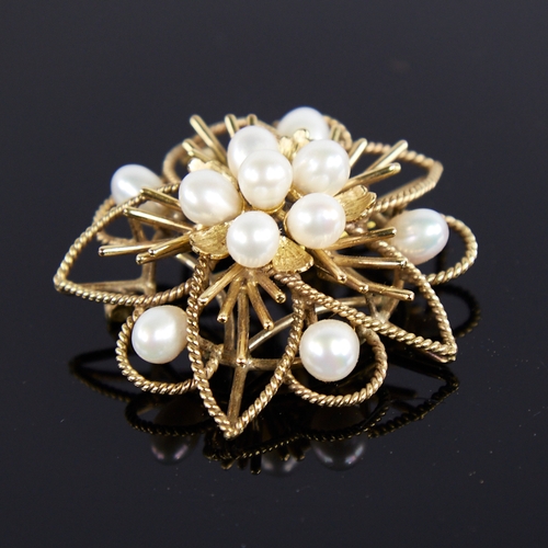 1234 - A Vintage Singaporean 14ct gold pearl floral brooch/pendant, openwork rope twist decoration with pea... 