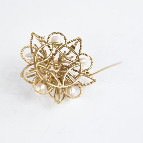 1234 - A Vintage Singaporean 14ct gold pearl floral brooch/pendant, openwork rope twist decoration with pea... 