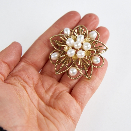 1234 - A Vintage Singaporean 14ct gold pearl floral brooch/pendant, openwork rope twist decoration with pea... 