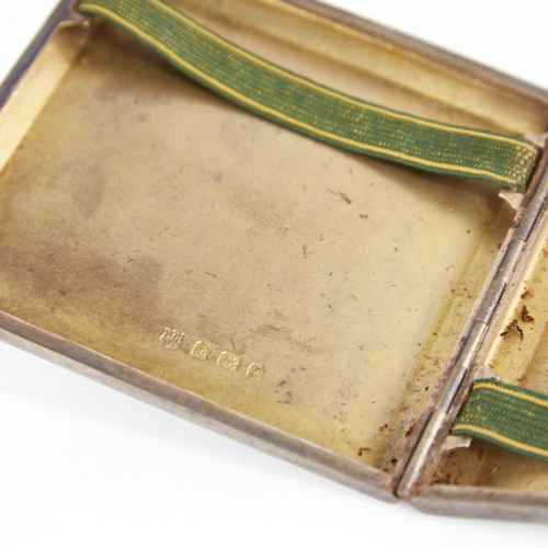 1235 - A George V Art Deco silver cigarette case, square form with wavey engine turned decoration and gilt ... 