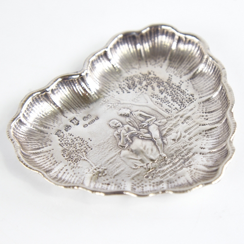 1237 - A late 19th/early 20th century German silver heart-shaped dish, Hanau, relief embossed lover decorat... 