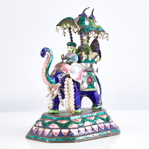 1247 - An early 20th century Indian unmarked silver and enamel caparisoned elephant model, with howdah and ... 