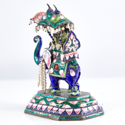 1247 - An early 20th century Indian unmarked silver and enamel caparisoned elephant model, with howdah and ... 