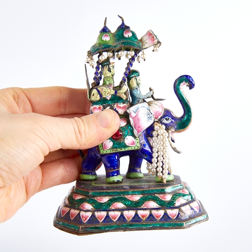 1247 - An early 20th century Indian unmarked silver and enamel caparisoned elephant model, with howdah and ... 