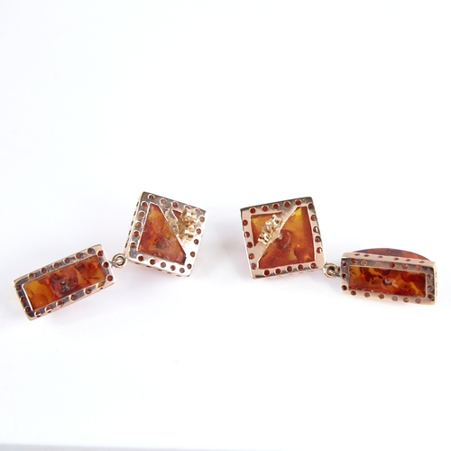 1250 - A Vintage amber demi-parure, comprising unmarked gold-mounted pendant and pair of unmarked gold-moun... 