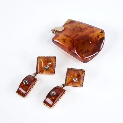 1250 - A Vintage amber demi-parure, comprising unmarked gold-mounted pendant and pair of unmarked gold-moun... 