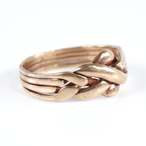 1251 - A modern 9ct gold puzzle knot ring, formed as 4 separate bands intertwined, setting height 10.8mm, s... 