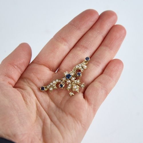 1262 - An Art Nouveau 9ct gold sapphire and split-pearl and floral brooch, brooch length 44.8mm, 5.8g