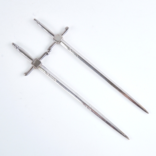 1268 - A pair of Victorian silver sword paper knives, by William Hutton & Sons, hallmarks Sheffield 1876, o... 