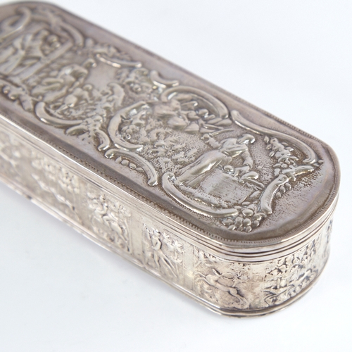 1269 - A 19th century Dutch silver tobacco box, allover relief embossed village and hunting scenes, length ... 