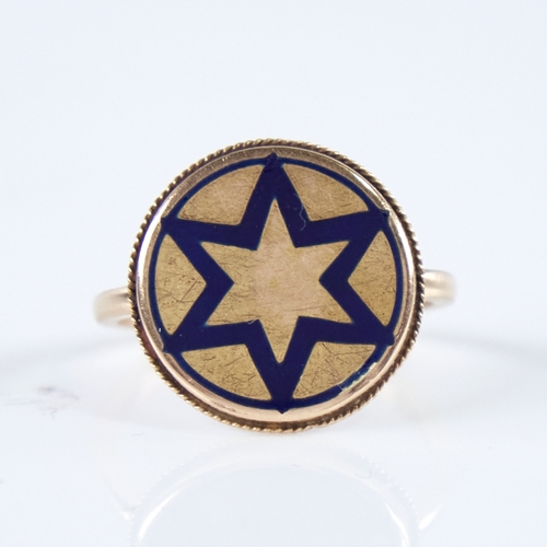 1271 - A 19th century unmarked gold blue enamel star insignia panel ring, within rope twist surround, panel... 