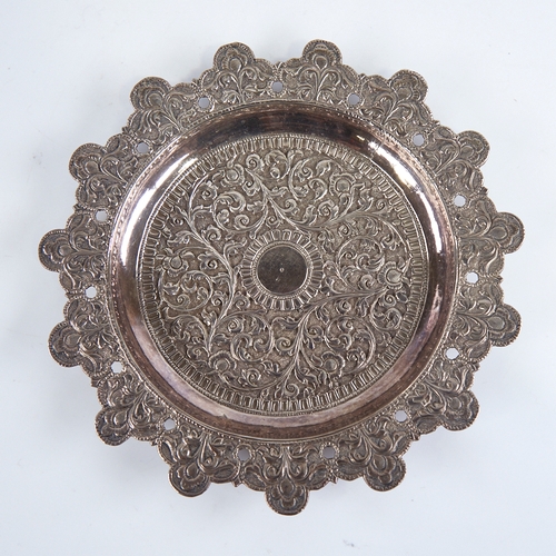 1277 - A late 19th/early 20th century Indian unmarked white metal pin dish, allover relief embossed foliate... 