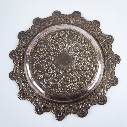 1277 - A late 19th/early 20th century Indian unmarked white metal pin dish, allover relief embossed foliate... 