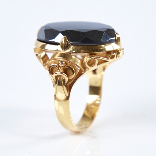 1279 - A late 20th century Chinese high carat gold hematite ring, set with a large oval-cut hematite with o... 