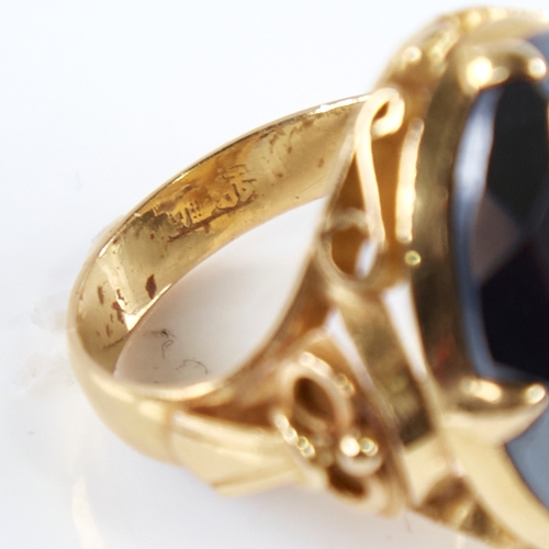 1279 - A late 20th century Chinese high carat gold hematite ring, set with a large oval-cut hematite with o... 