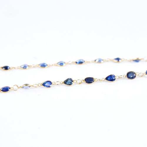 1287 - A modern handmade unmarked high carat gold sapphire line necklace, set with oval and pear-cut sapphi... 