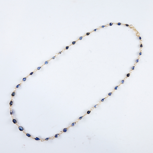 1287 - A modern handmade unmarked high carat gold sapphire line necklace, set with oval and pear-cut sapphi... 