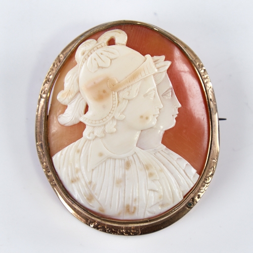 1289 - A 19th century relief carved shell cameo brooch, depicting 2 Classical profiles, in pinchbeck frame,... 