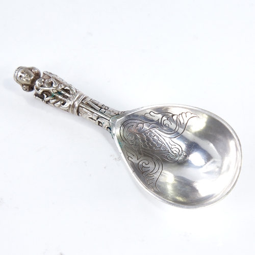 1292 - An early 20th century Danish silver presentation ladle, religious figure decorated handle with folia... 