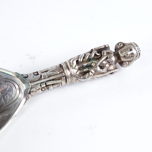 1292 - An early 20th century Danish silver presentation ladle, religious figure decorated handle with folia... 