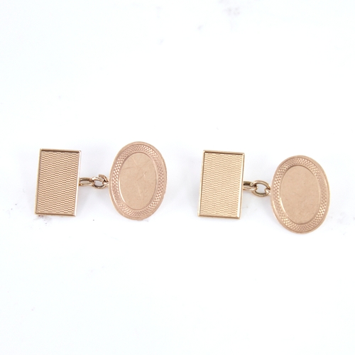 1295 - A pair of early 20th century 9ct gold cufflinks, oval and rectangular panels with engine turned deco... 