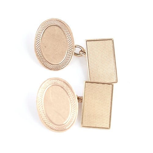 1295 - A pair of early 20th century 9ct gold cufflinks, oval and rectangular panels with engine turned deco... 