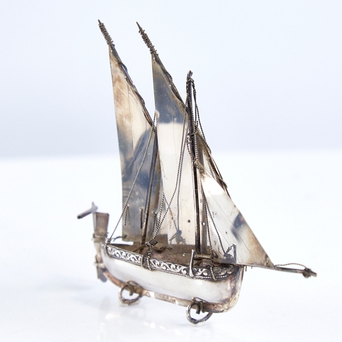 1299 - A modern Continental sterling silver miniature model ship, length 12.5cm, height 11cm