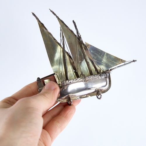 1299 - A modern Continental sterling silver miniature model ship, length 12.5cm, height 11cm