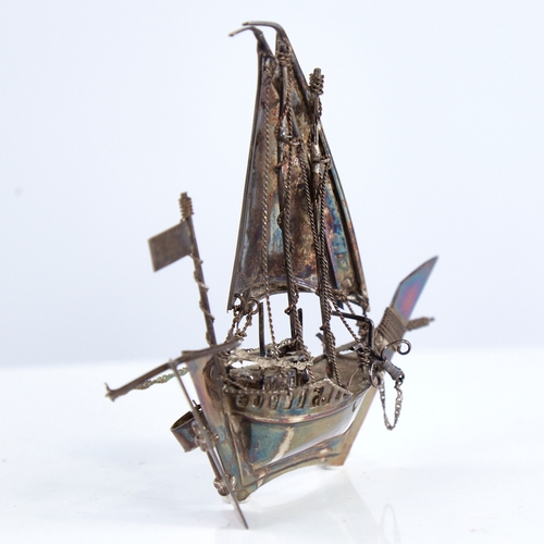 1300 - A modern Continental sterling silver miniature model ship, length 12.5cm, height 12cm