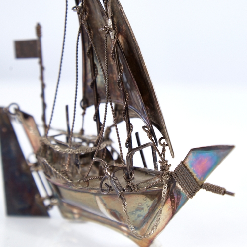 1300 - A modern Continental sterling silver miniature model ship, length 12.5cm, height 12cm