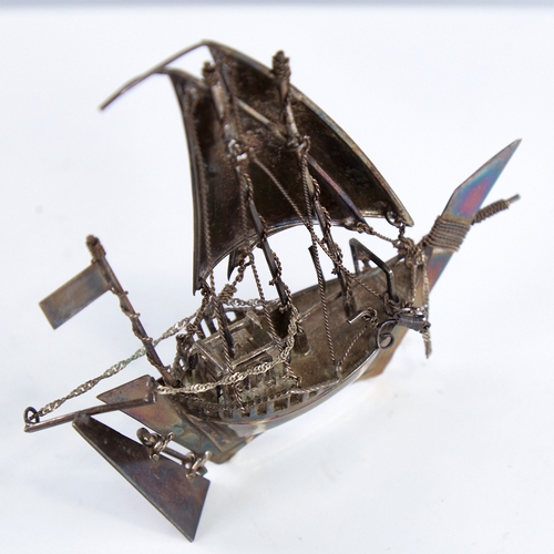 1300 - A modern Continental sterling silver miniature model ship, length 12.5cm, height 12cm