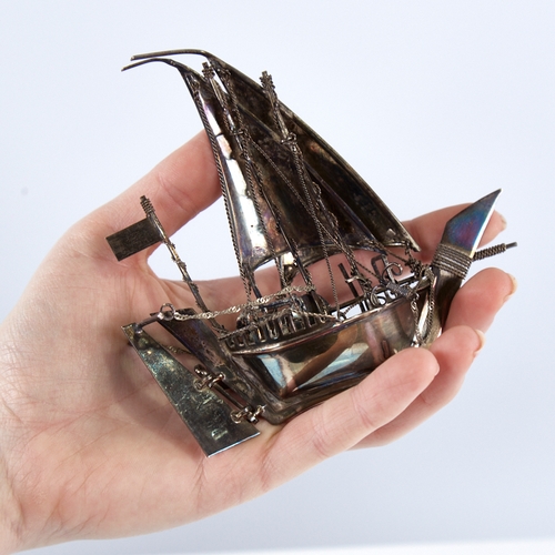 1300 - A modern Continental sterling silver miniature model ship, length 12.5cm, height 12cm