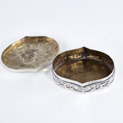 1305 - A late Victorian Art Nouveau silver dressing table box and cover, oval form with relief embossed che... 