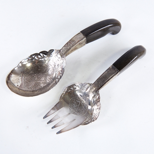 1306 - A pair of Middle Eastern unmarked silver horn-handled salad servers, pierced and engraved floral dec... 