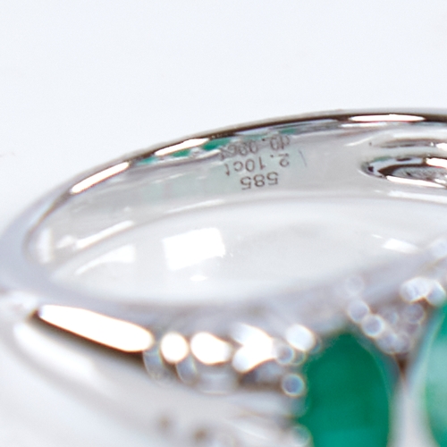 1307 - A modern 14ct white gold graduate 5-stone emerald and diamond half hoop ring, set with oval-cut emer... 