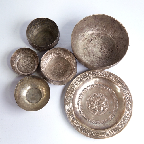 1313 - A group of various Eastern unmarked white metal bowls and trays, largest diameter 14cm, 9.4oz total ... 