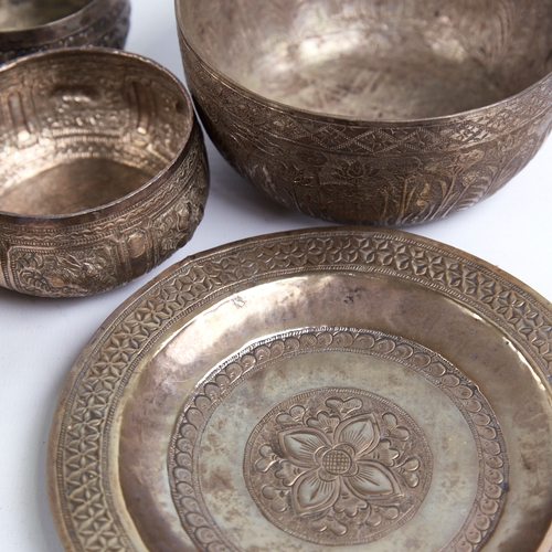 1313 - A group of various Eastern unmarked white metal bowls and trays, largest diameter 14cm, 9.4oz total ... 