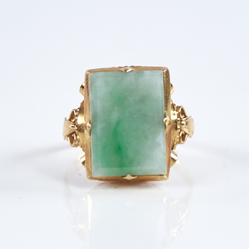 1315 - A late 20th century Chinese high carat gold jade panel ring, set with rectangular-cut jade panel wit... 