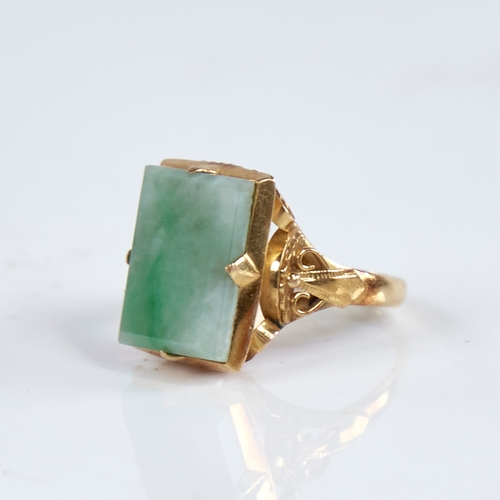 1315 - A late 20th century Chinese high carat gold jade panel ring, set with rectangular-cut jade panel wit... 