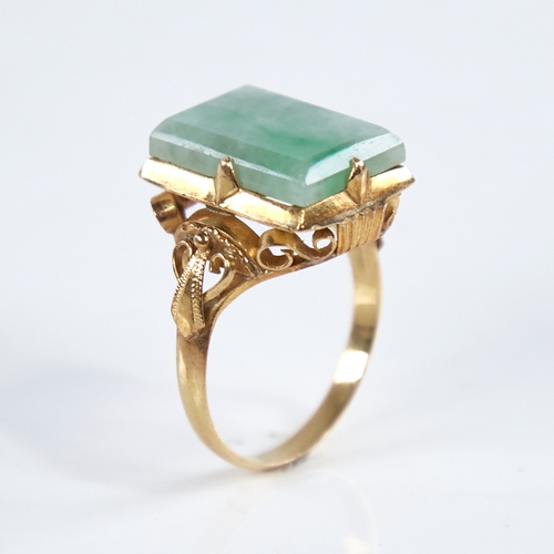 1315 - A late 20th century Chinese high carat gold jade panel ring, set with rectangular-cut jade panel wit... 