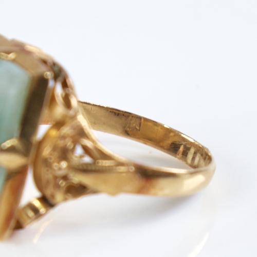 1315 - A late 20th century Chinese high carat gold jade panel ring, set with rectangular-cut jade panel wit... 