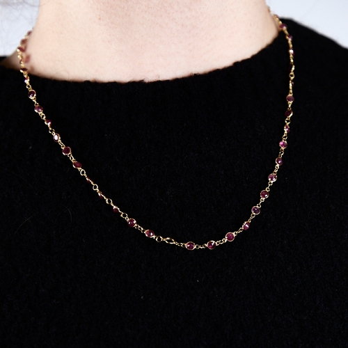 1316 - A modern handmade unmarked high carat gold ruby line necklace, set with round-cut rubies, necklace l... 