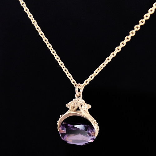 1326 - A late 20th century 9ct gold amethyst swivel fob pendant necklace, on unmarked gilt metal chain, pen... 